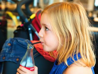 Young girl drinking soft drink | Kids dental health